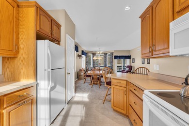 SOUGHT AFTER STAND ALONE CONDO IN SUMMIT TOWNSHIP! Striking curb