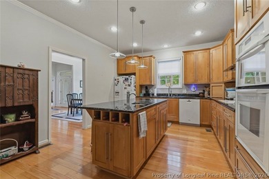 Nestled on a beautifully landscaped 1.17-acre lot in a lovely - photo 12