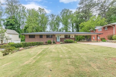 A classic brick ranch, reimagined with intention and scale, set - photo 1