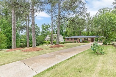 A classic brick ranch, reimagined with intention and scale, set - photo 2