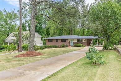 A classic brick ranch, reimagined with intention and scale, set - photo 3