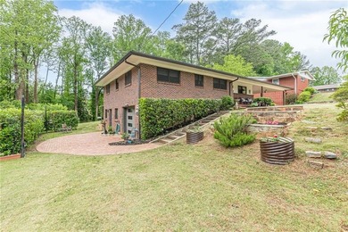 A classic brick ranch, reimagined with intention and scale, set - photo 5