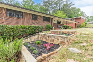 A classic brick ranch, reimagined with intention and scale, set - photo 7