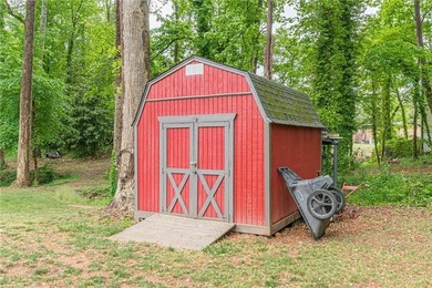 A classic brick ranch, reimagined with intention and scale, set - photo 9