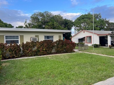 Income-producing triplex located at 182 W 34th Street, Riviera - photo 1