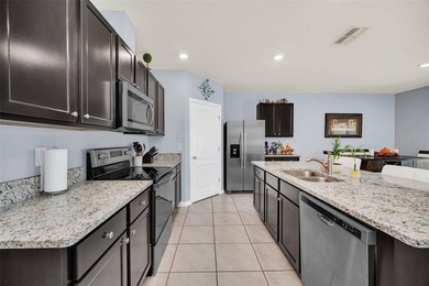 Welcome to this stunning 4-bedroom, 2-bath home located in a - photo 6