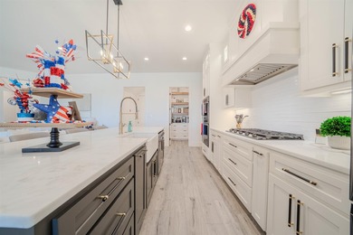Welcome to elevated living in this stunning custom-built home - photo 9