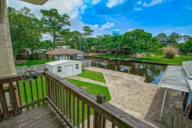 WATERFRONT LIVING AT IT'S BEST. BOAT DOCK AND HOIST IS - photo 3