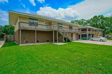 WATERFRONT LIVING AT IT'S BEST. BOAT DOCK AND HOIST IS - photo 5