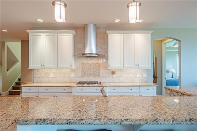 Welcome to waterfront living at its finest. Perched above the - photo 18
