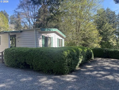 This well-maintained manufactured home is tucked in the hills - photo 1