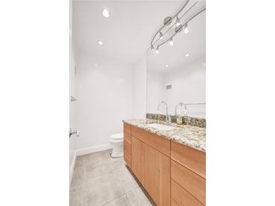 Rarely available 1BR/1.5BA corner unit in the heart of Fort