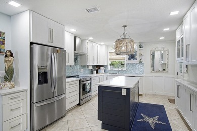 Tucked away just moments from the shoreline, this immaculate - photo 10