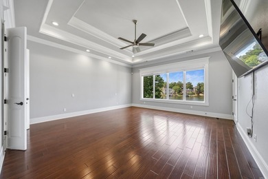 Experience exceptional waterfront living in this custom-built - photo 12