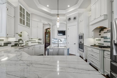 Experience exceptional waterfront living in this custom-built - photo 13