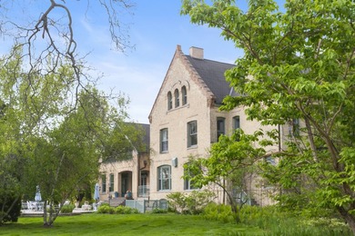 Historic lakefront Queen Anne mansion on Lake Michigan! Set on a - photo 1