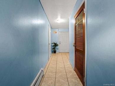 This three-story brick two-family home in Cypress Hills features - photo 13