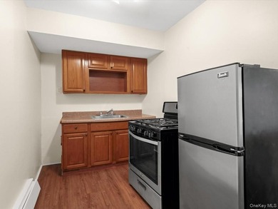 This three-story brick two-family home in Cypress Hills features - photo 15