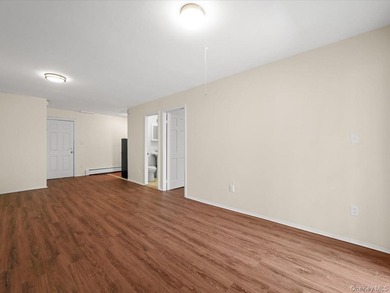 This three-story brick two-family home in Cypress Hills features - photo 17