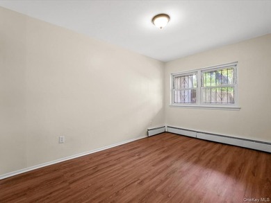 This three-story brick two-family home in Cypress Hills features - photo 18