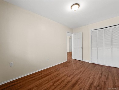 This three-story brick two-family home in Cypress Hills features - photo 19