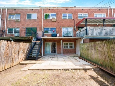 This three-story brick two-family home in Cypress Hills features - photo 21