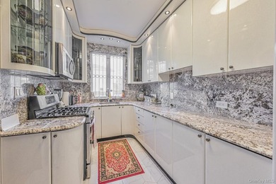 Discover this beautifully renovated legal two-family home in the - photo 6