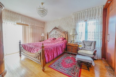 Discover this beautifully renovated legal two-family home in the - photo 8