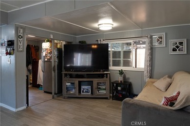 Ready to move in! This affordable, low land lease mobile home in - photo 3