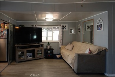 Ready to move in! This affordable, low land lease mobile home in - photo 4