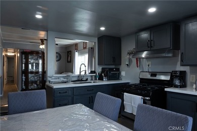 Ready to move in! This affordable, low land lease mobile home in - photo 9