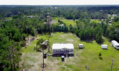 Wow...Look at this home only miles from the Gulf! This sweet - photo 3
