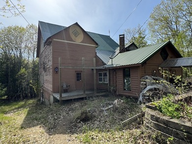 Quaint log cabin with attached incomplete 30 x 40 multi story - photo 1
