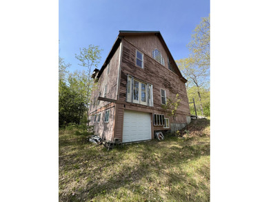 Quaint log cabin with attached incomplete 30 x 40 multi story - photo 2