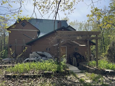 Quaint log cabin with attached incomplete 30 x 40 multi story - photo 3