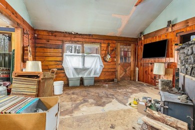 Quaint log cabin with attached incomplete 30 x 40 multi story - photo 8
