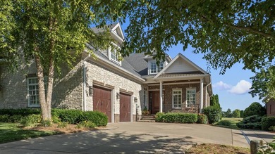 Located in the prestigious Olde Stone community, this stunning - photo 1