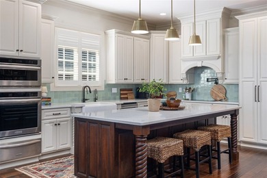 Located in the prestigious Olde Stone community, this stunning - photo 5