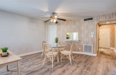 This single-level villa-style condo is nestled in a highly - photo 3