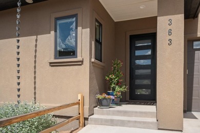 Located in the prestigious Redlands Mesa Golf Community, this - photo 2