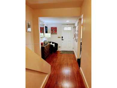 ?In the heart of Aventura, this two story townhome *treehouse*