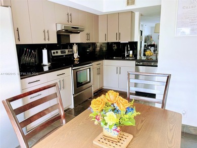 ?In the heart of Aventura, this two story townhome *treehouse*