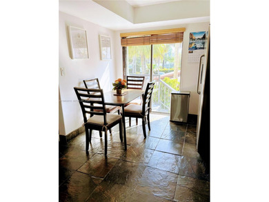 ?In the heart of Aventura, this two story townhome *treehouse*