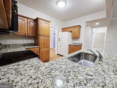 Welcome home to this beautifully maintained townhome nestled on - photo 8