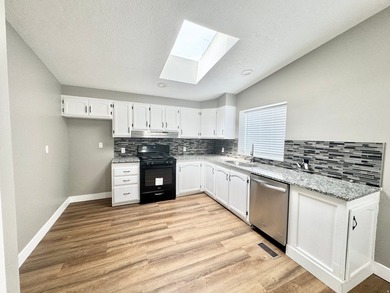 3 bedrooms, 2 remodeled bathrooms, fresh pained laminate - photo 3