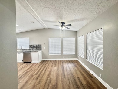 3 bedrooms, 2 remodeled bathrooms, fresh pained laminate - photo 4