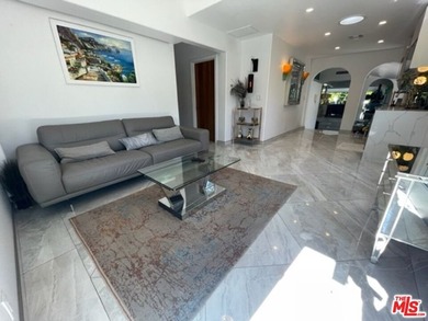 Welcome to a captivating coastal Mediterranean-style retreat in - photo 1