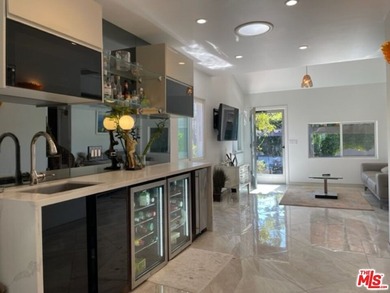 Welcome to a captivating coastal Mediterranean-style retreat in - photo 2