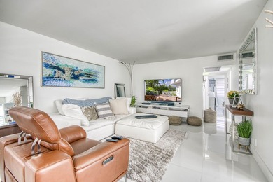Beautifully remodeled 2BR/1.5BA upstairs corner condo with water - photo 2