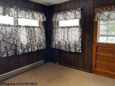 Single, brick ranch style home in a country setting with three